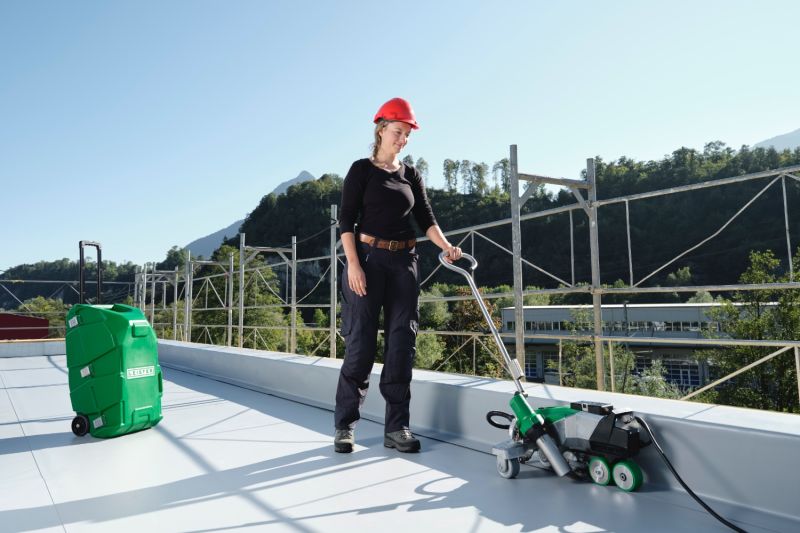 Leister VARIMAT 700 230V 3680W 173.180 automatic roof welder job site application 3 with tool case carry truck